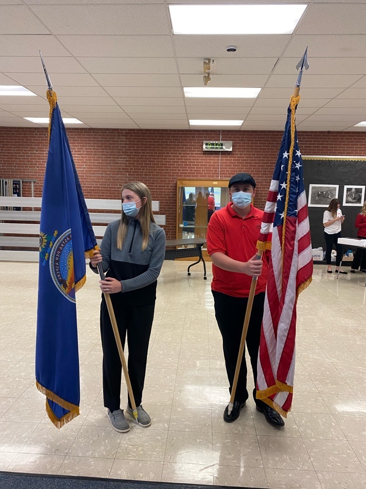 Ty and Lexi presenting the flags