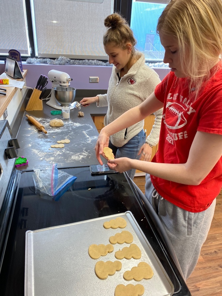 Cutting and Baking their cookies